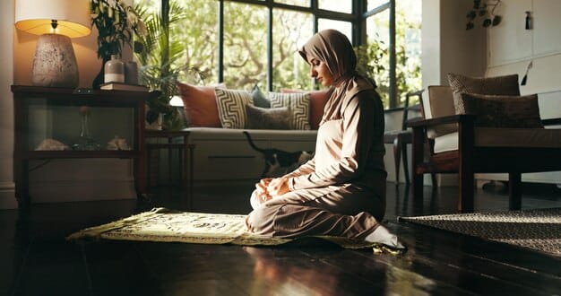 A person setting up a peaceful meditation space in their home, with soft lighting, a comfortable cushion, and minimal distractions, emphasizing the importance of environment for effective meditation.