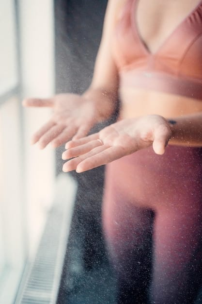 A close-up shot of hands gently pressing into a yoga mat, with the sun highlighting the texture of the mat and the subtle engagement of muscles in the arms and hands.