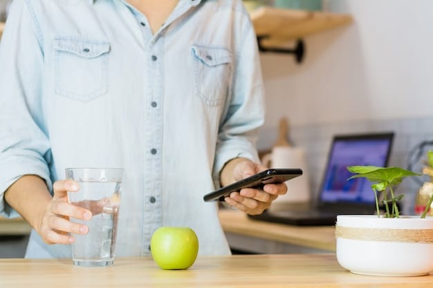 A desk setup with a person using a hydration tracking app on their smartphone, next to a water bottle and a to-do list.