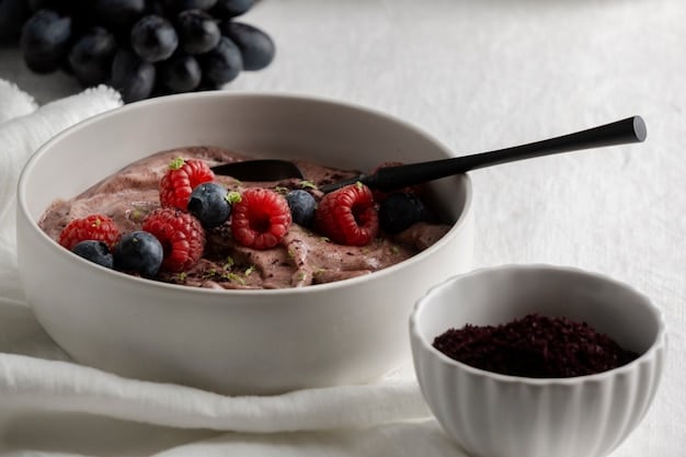 A close-up shot of a nutritious and balanced breakfast featuring Greek yogurt with berries and a sprinkle of nuts, emphasizing a high-protein morning meal.