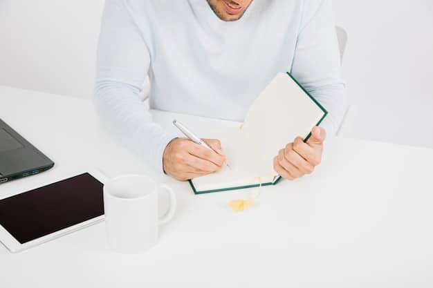 Close-up shot of a person writing in a journal in a bright, modern workspace with natural light. The person is focused and reflective, suggesting the act of planning or contemplating how to communicate effectively. The setting is clean and organized, promoting concentration.