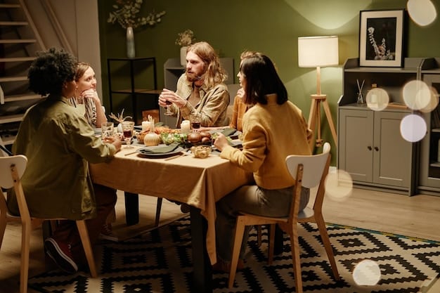 A family sitting around a dining table, engaging in a lively conversation during dinner.