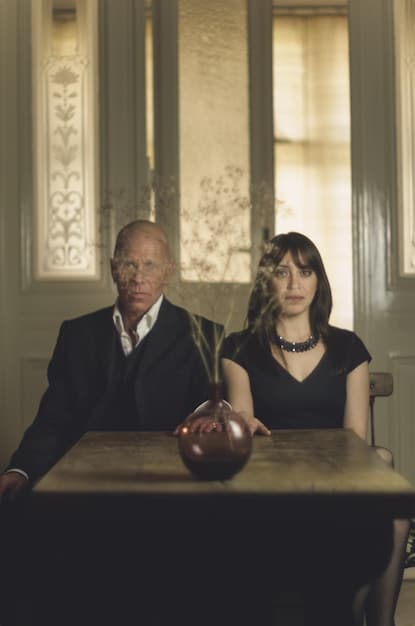 A photo illustrating a courtroom focusing on the judge and a lawyer with an intent look.