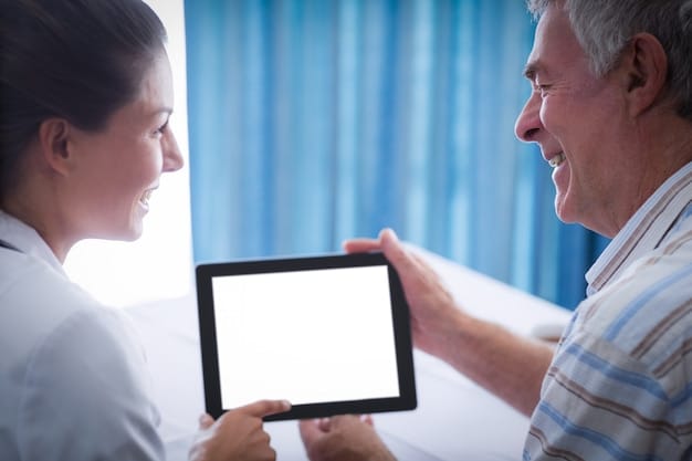 A doctor explaining Medicare coverage options to a patient and their caregiver, using a tablet to display information.