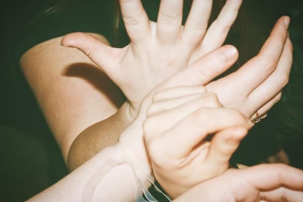 A close-up shot of three pairs of hands clasped together in a circle, symbolizing unity and support. The background is blurred, focusing attention on the hands and the sense of togetherness.
