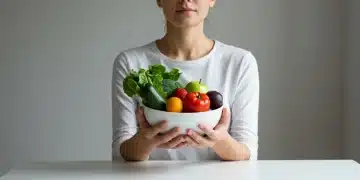 Person practicing mindful eating with a bowl of fresh fruit, signifying peace.