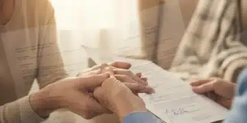 Caregiver holding hand of elderly person, symbolizing elder abuse reporting guidelines.